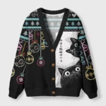 Front view of the cats are watching cardigan sweater featuring a playful cat design on a black background.