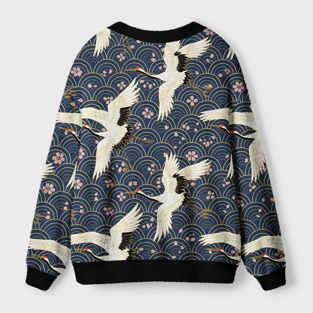 White Crane Japan Cardigan Sweater Back view of the white crane japan cardigan sweater showcasing intricate patterns and rich color contrast.