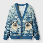 Front view of the siamese cat and fish cardigan sweater featuring a vibrant design with fish and cats in shades of blue.