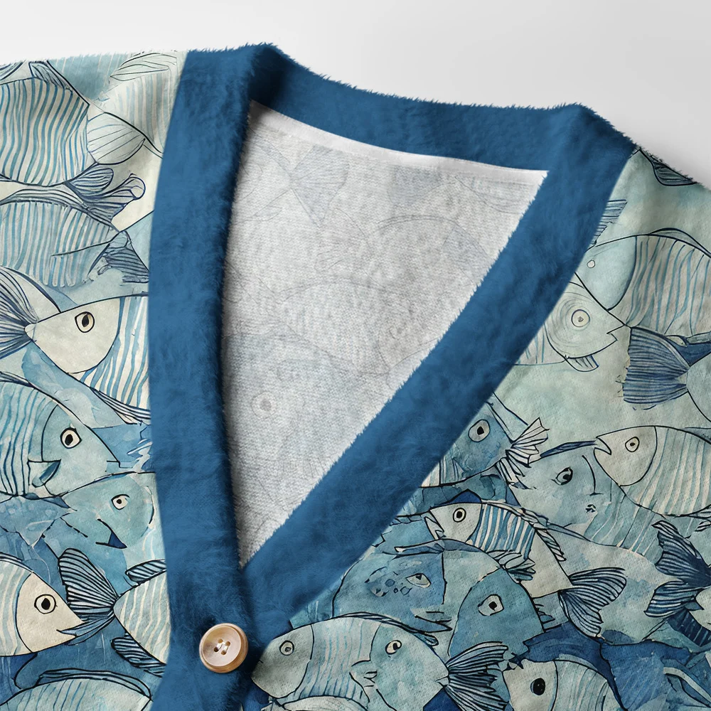 Siamese Cat and Fish Cardigan Sweater Close-up detail of the siamese cat and fish cardigan sweater highlighting the intricate artwork and button features.