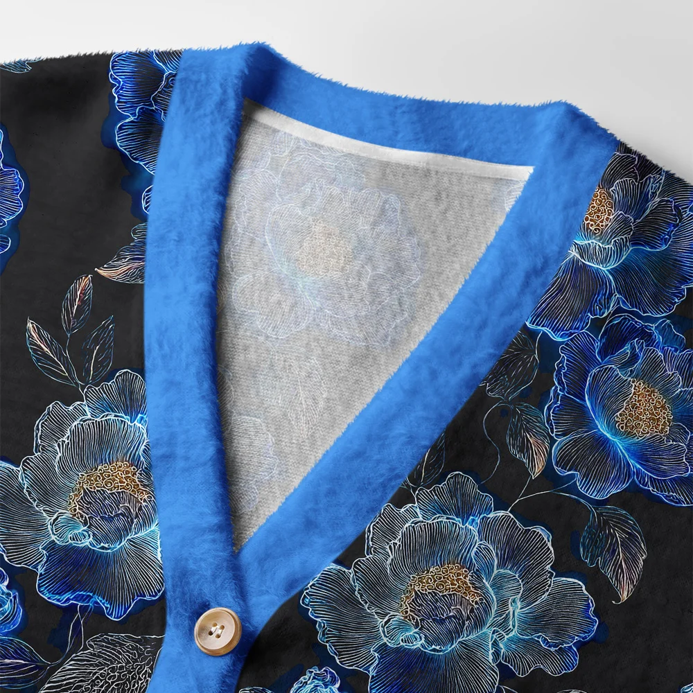 Sea of Flowers Cardigan Sweater | Floral Design Close-up detail of the sea of flowers cardigan sweater highlighting the intricate floral design and soft texture.
