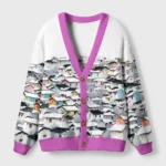 Front view of the lights of a thousand homes cardigan, featuring a colorful house design and a purple trim.