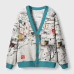 Front view of the white of winter cardigan sweater featuring a vibrant winter art design and teal trim.
