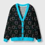 Front view of the midnight moth cardigan sweater featuring a vibrant turquoise trim and whimsical moth patterns.
