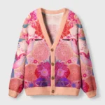 Front view of the Birdsong & Blossoms cardigan sweater showcasing vibrant floral and bird designs in pink hues.
