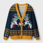Front view of dark holiday humor cardigan sweater featuring skeletons with lights on a navy background