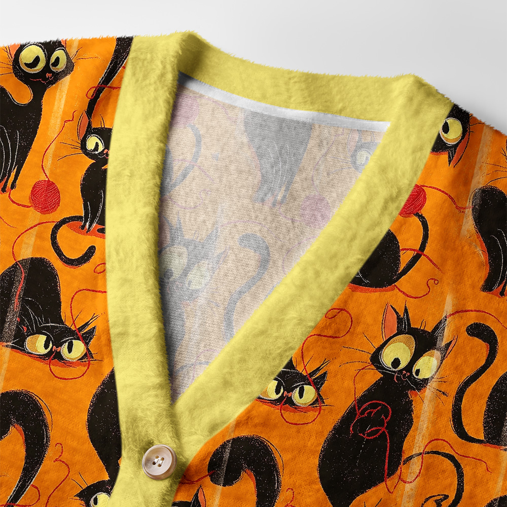 Prowling Cats Cardigan Sweater | Artistic Cat Pattern Close-up detail of the prowling cats cardigan sweater highlighting the unique textures and colors of the fabric.